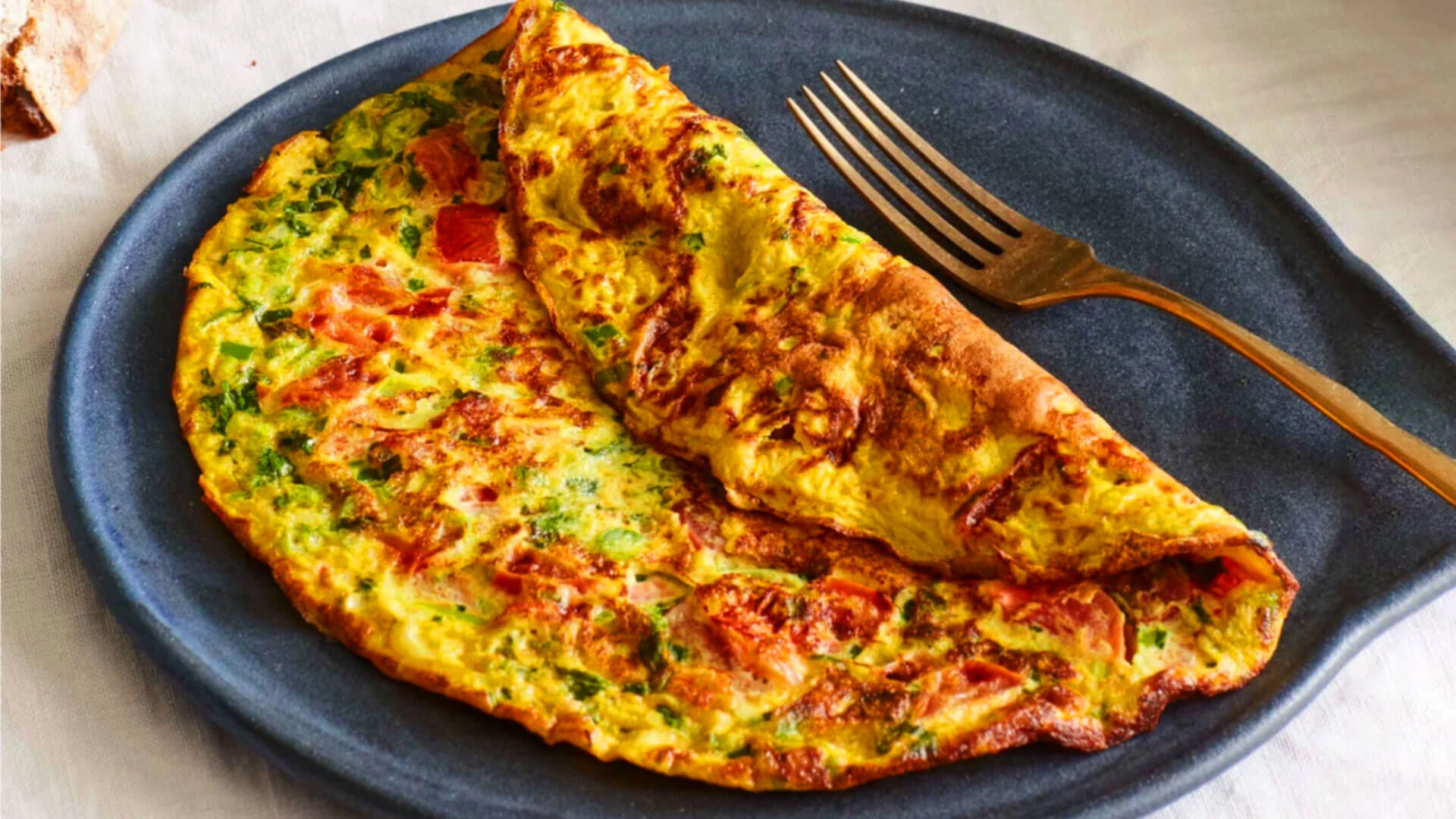 Classic Pakistani Masala Omelette served with paratha